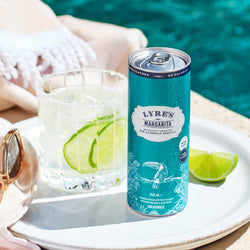 Lyre's Margarita Can with non-alcoholic margarita in a glass