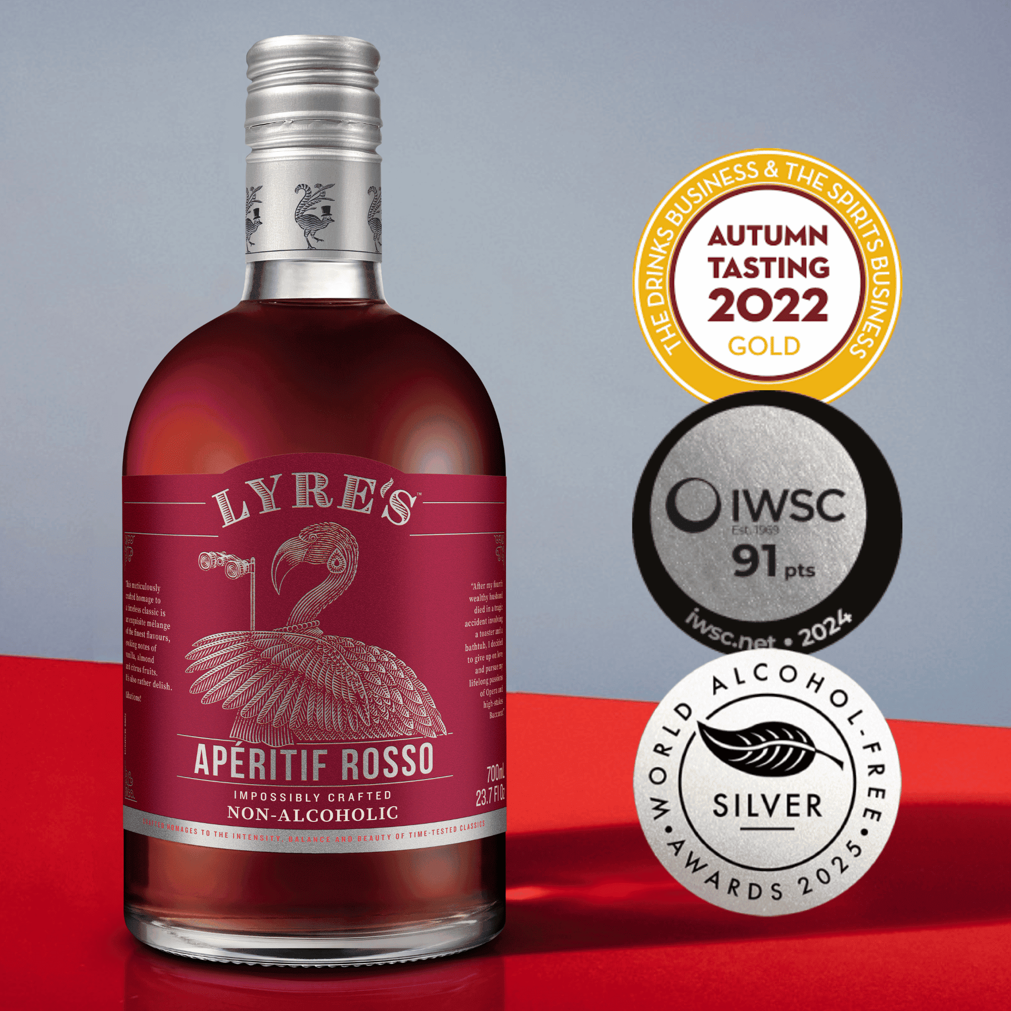 Bottle of Lyre's Aperitif Rosso with awards on a red and gray background